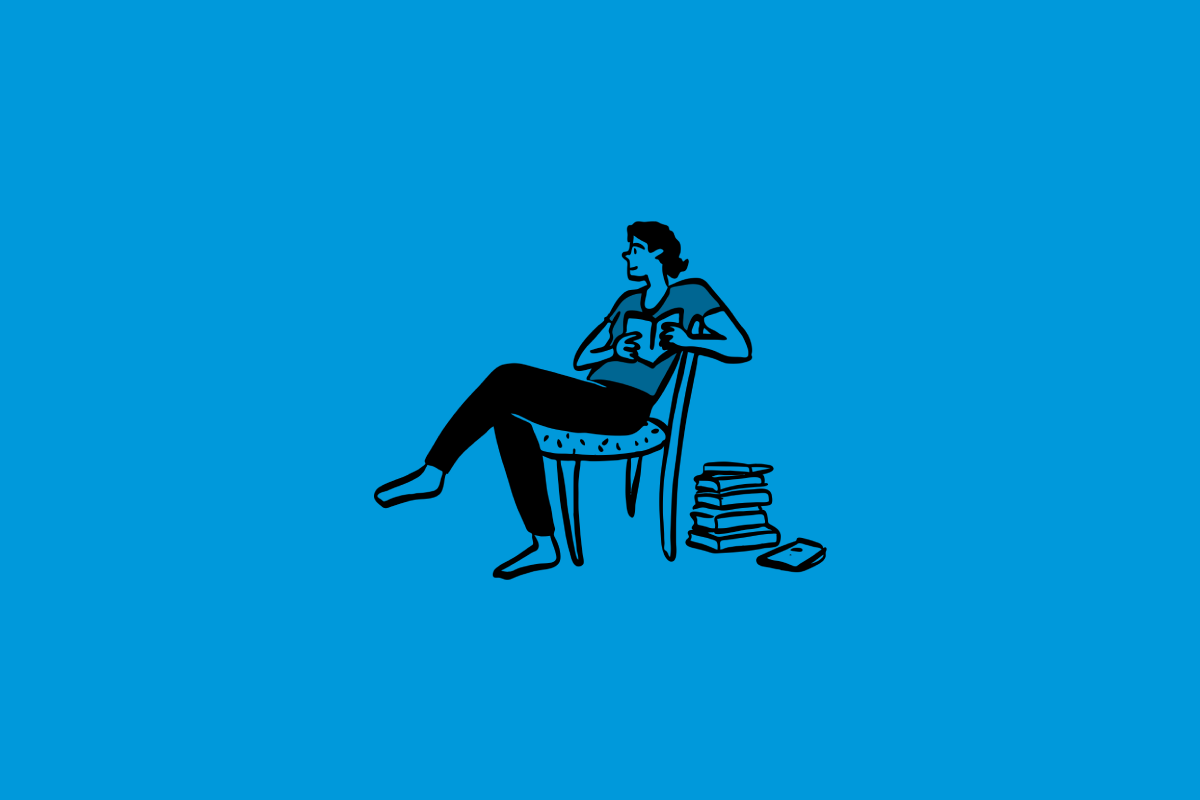 A stylized illustration of a person sitting in a chair, reading a book, with a stack of books on the floor near the chair.
