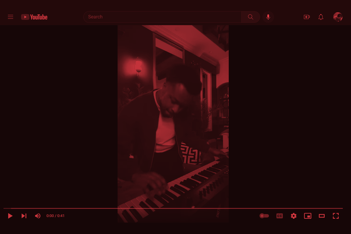 A screenshot of Kaelin Ellis playing a keyboard in a video for his song Peanuts.